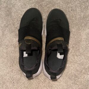 Black & gold Nike shoes. Size 8 women’s.